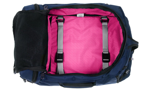 An open Techonaut 45 with a Deep Blue (dark blue) exterior and a Cerise (pink) interior.